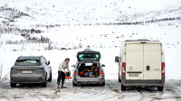 Hiker removes his boots after ski touring at Kattfjordeidet