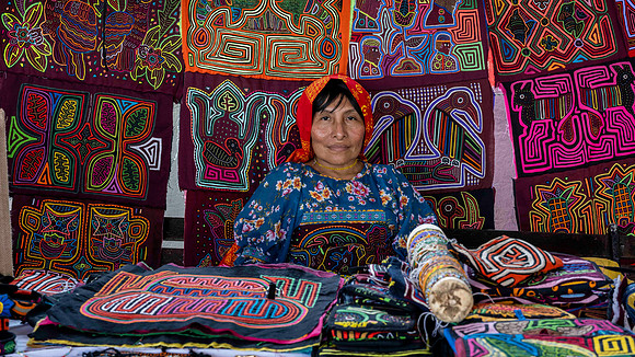 Indigenous resident selling traditional hand stitched material