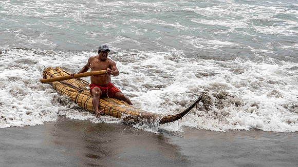 Huanchaco - demonstration of traditional fishing boat
